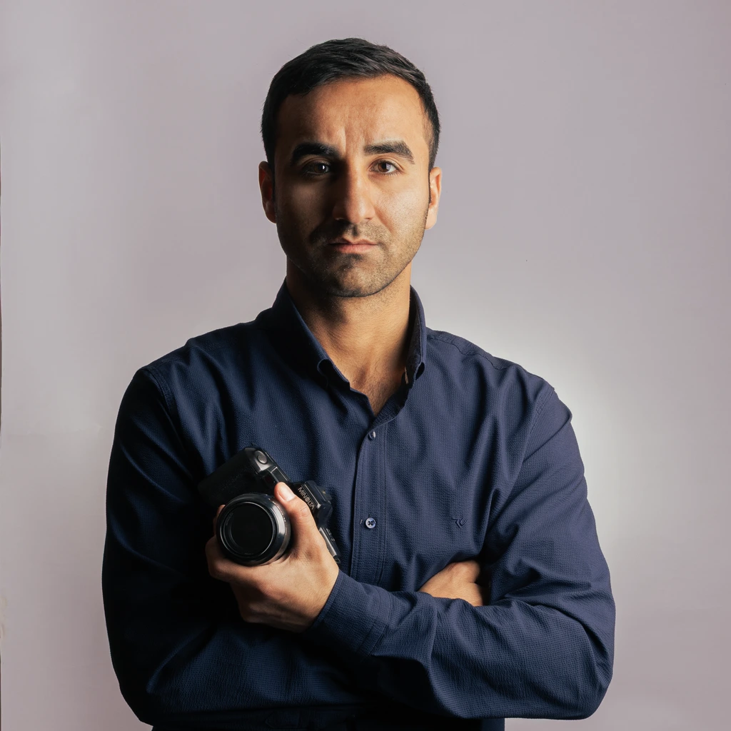 Tom Reece, deputy editor and cocktail lead, photographed pouring a stirred drink.